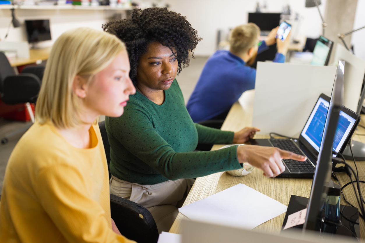 Cybersecurity Experts Work at a Desk With Computer Displays to Protect a Company’s Networks.