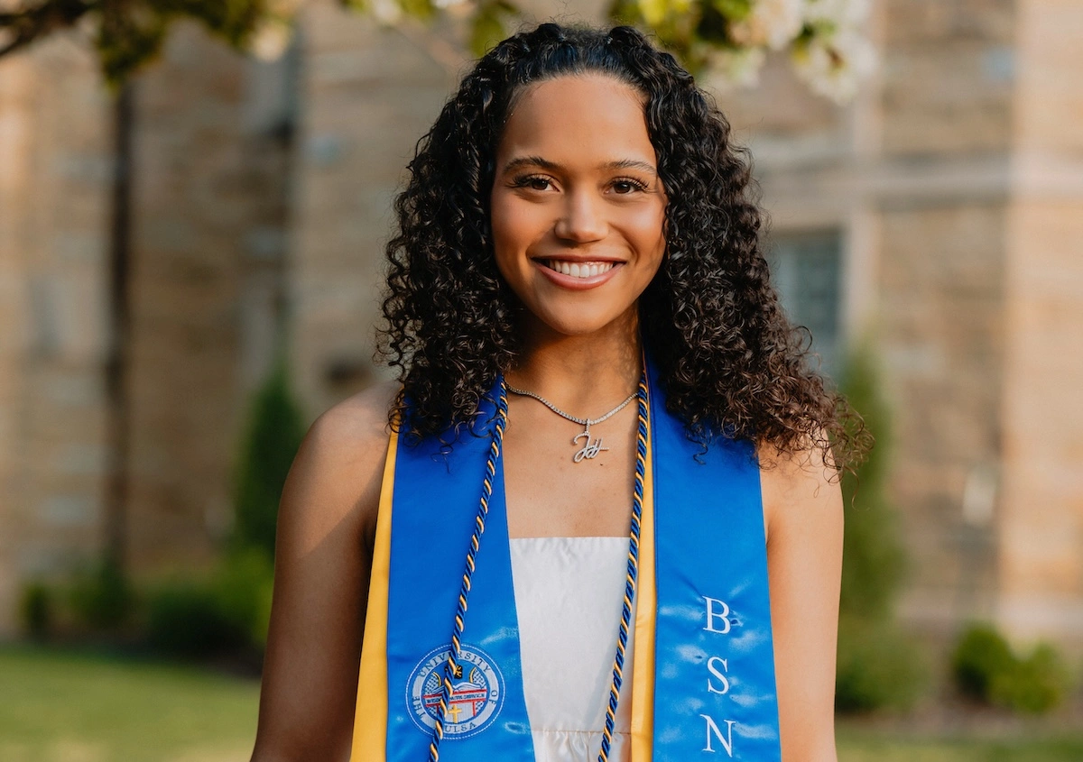 Headshot of Jessika Evans, MSN, wearing a graduation sash. 