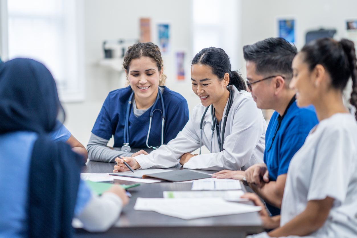 A Group of Nursing Students Listens to a Doctor Discuss a Patient Case..jpg