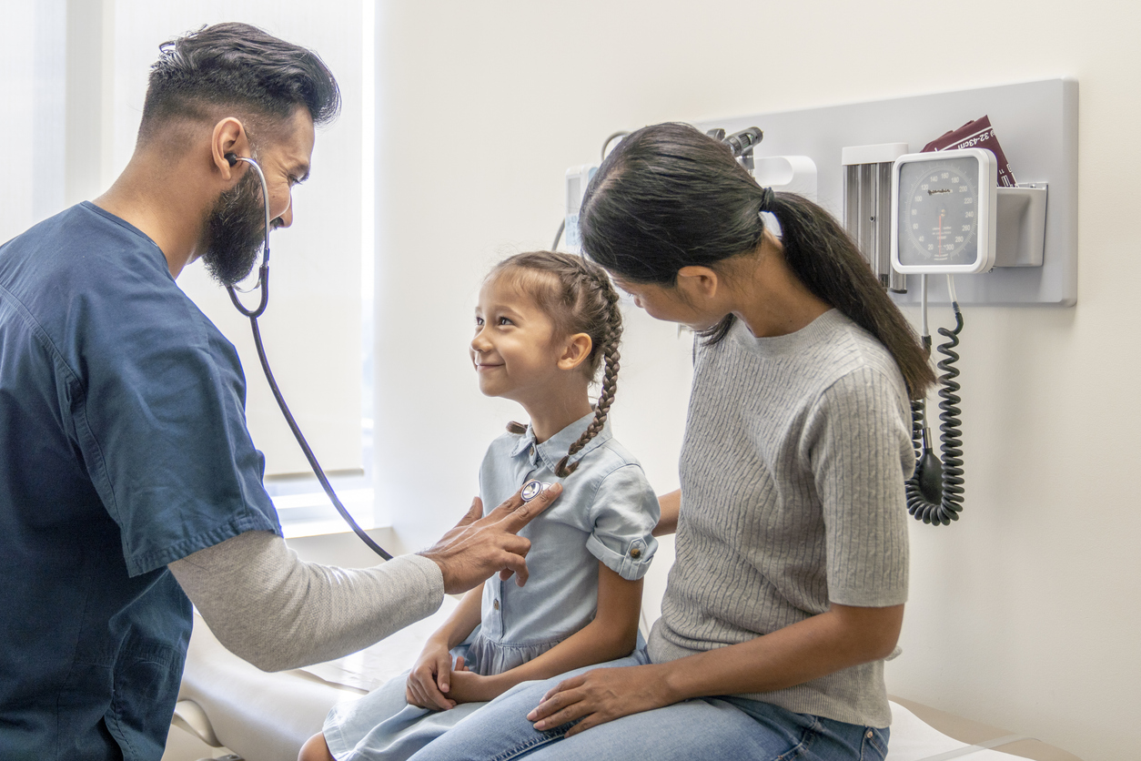A Family Nurse Practitioner Listens to a Child’s Heart With a Stethoscope